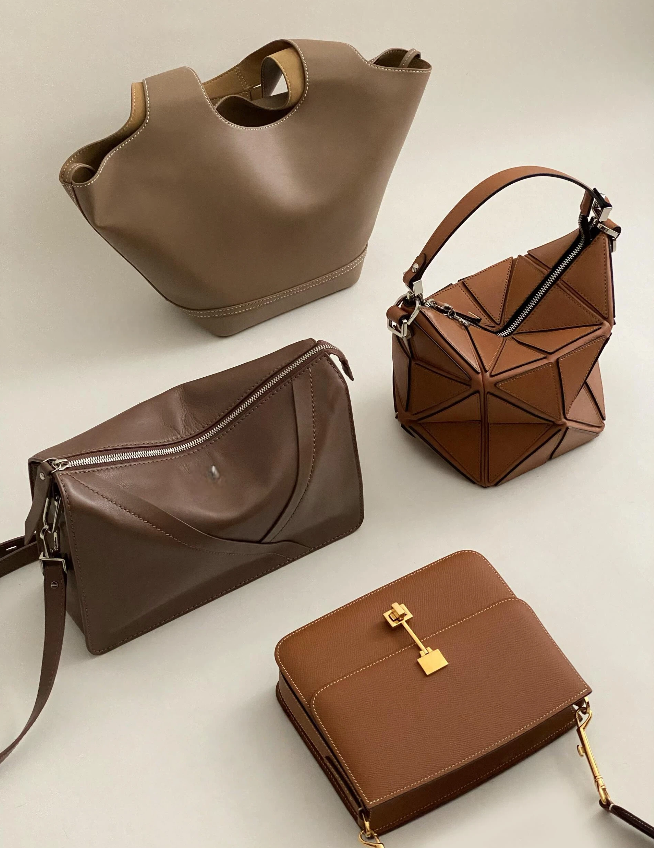 Artisan crafting luxury handbag